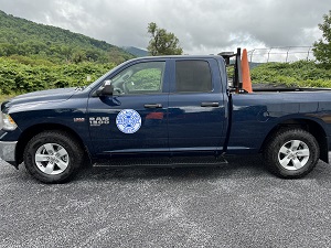 side view of dark blue pickup truck