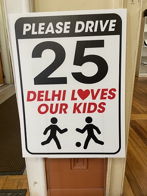 Drive 25 Delhi Loves Our Kids sign